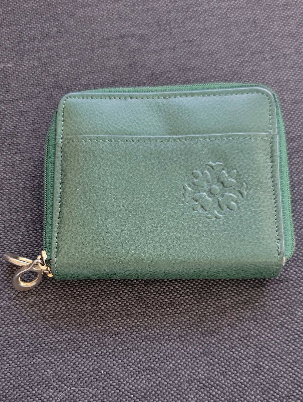 Green Leather Zip Wallet with Embossed Floral Emblem